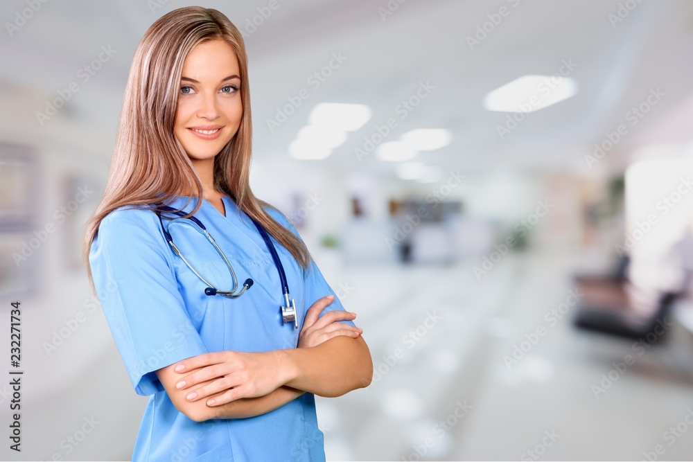 Portrait of woman doctor at hospital corridor