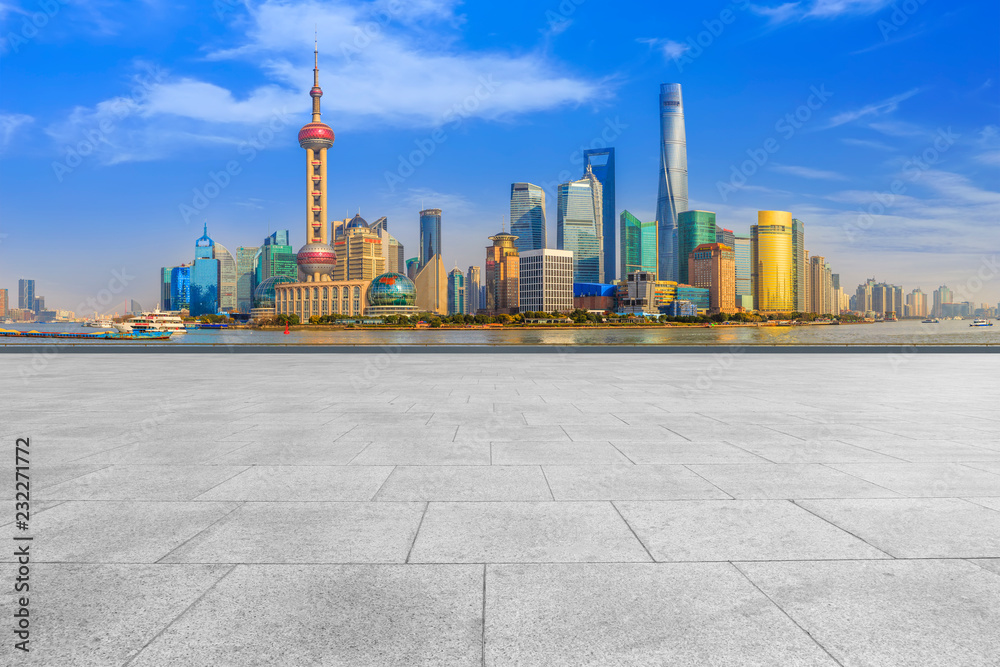 Blue sky, empty marble floor and skyline of Shanghai urban architecture.