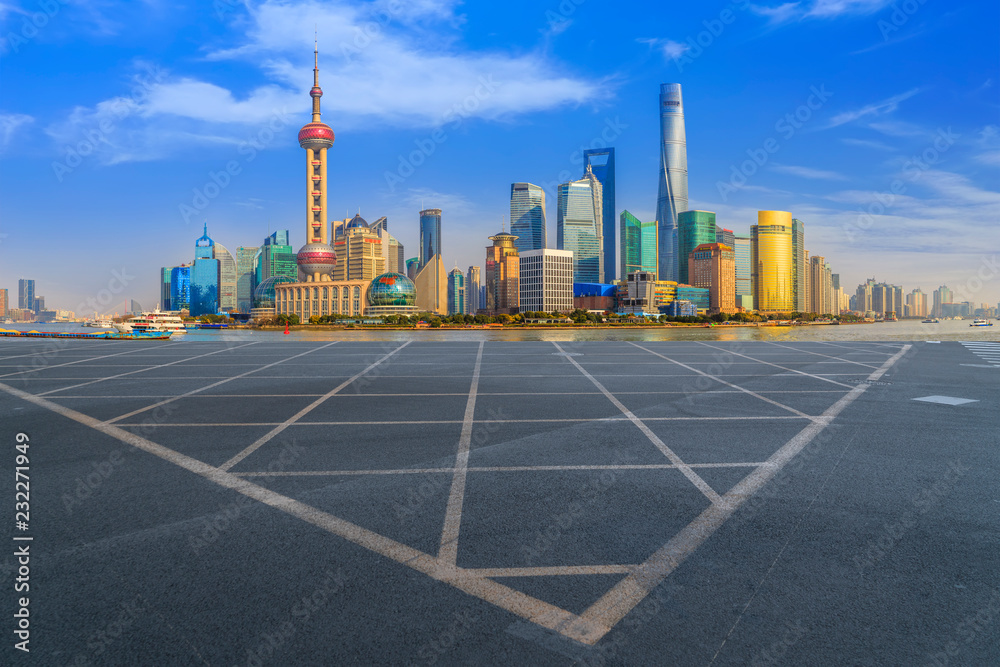 Empty asphalt road along modern commercial buildings in Chinas cities