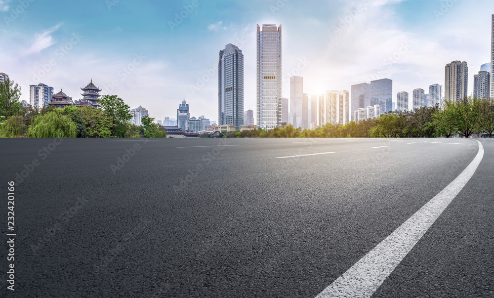 City skyscrapers and road asphalt pavement