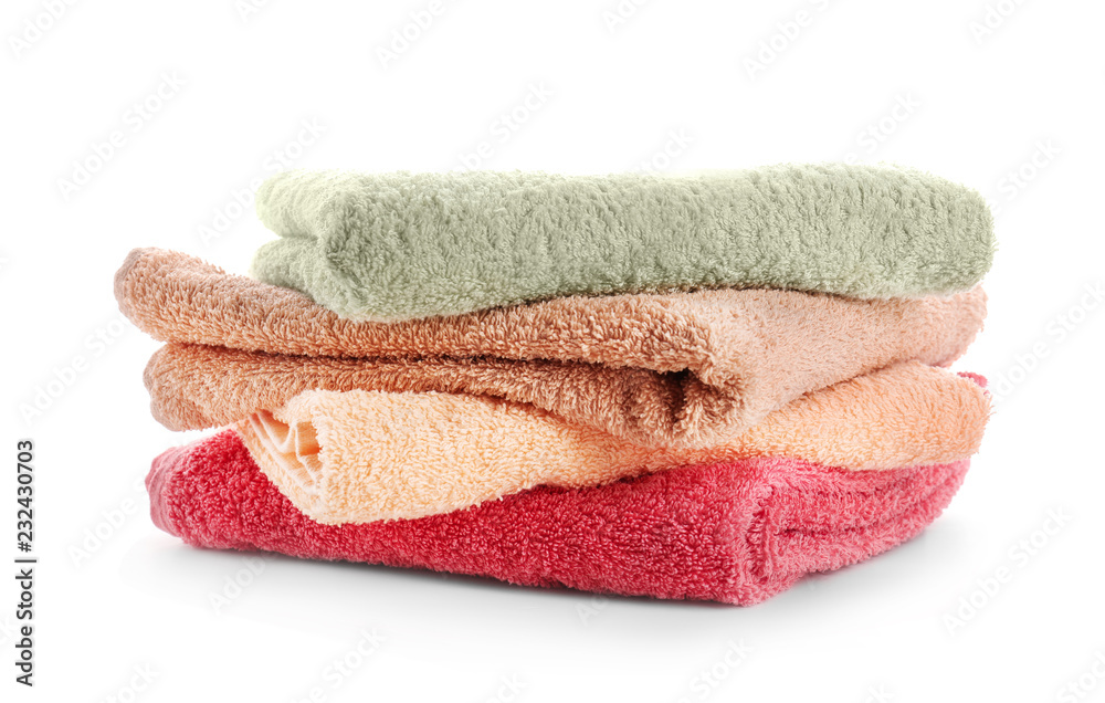 Stack of clean soft towels on white background