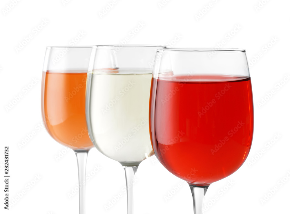 Glasses of different wine on white background