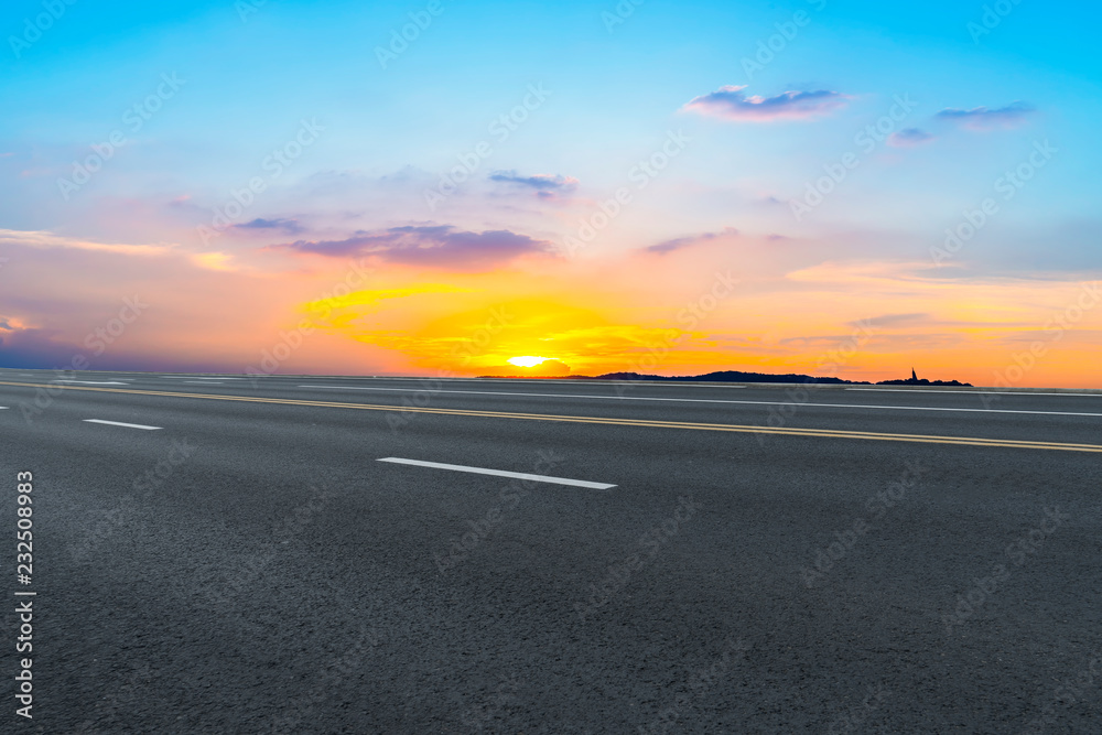 Empty highway asphalt pavement and sky cloud landscape..