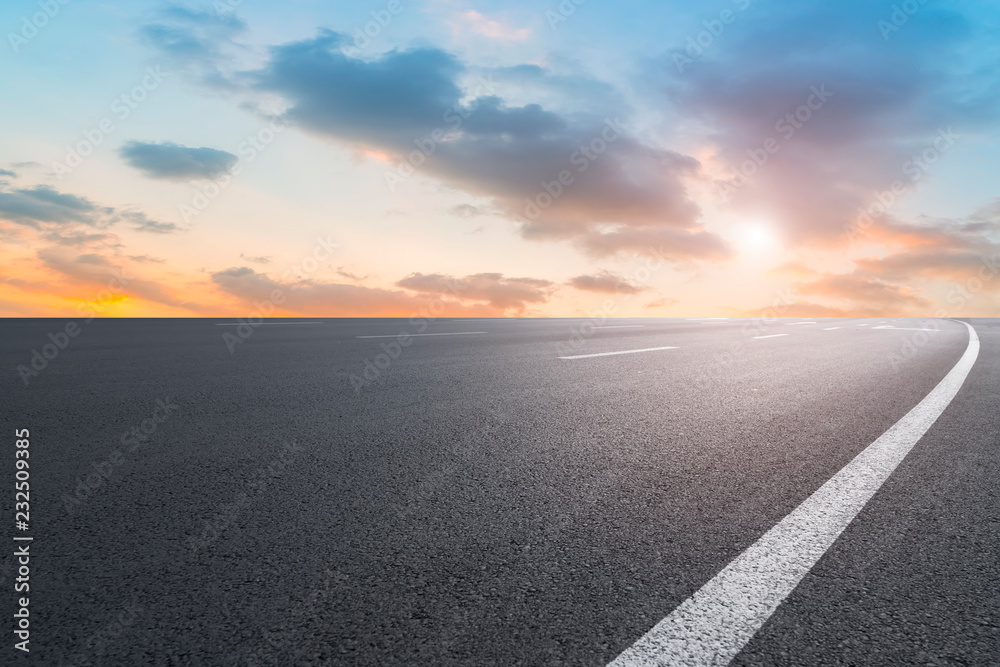 Empty highway asphalt pavement and sky cloud landscape..