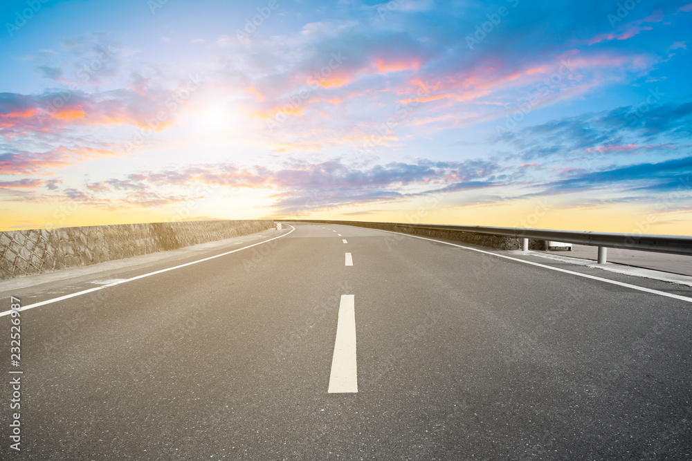 Empty highway asphalt pavement and sky cloud landscape..