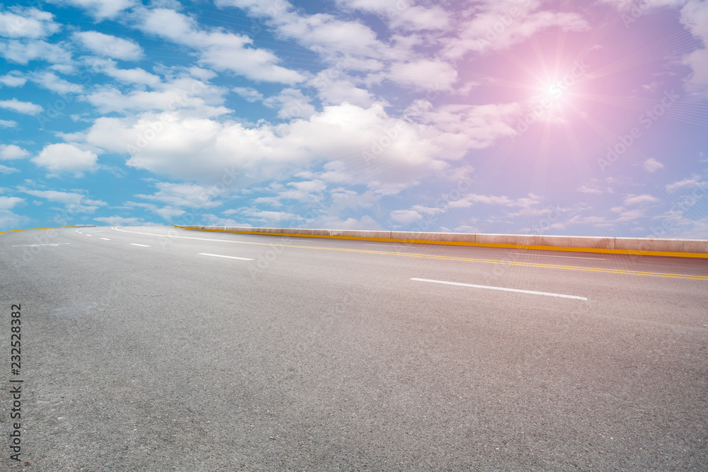 Empty asphalt road and natural landscape under the blue sky