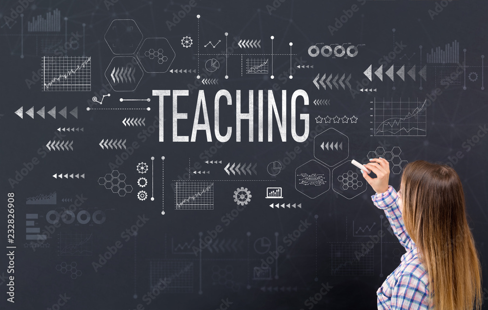 Teaching with young woman writing on a blackboard