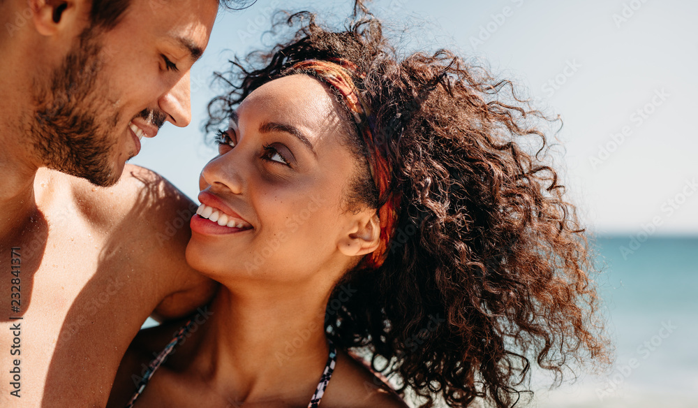 Close up of a woman with her boyfriend at the beach