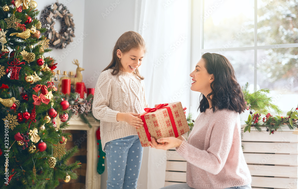 mom and daughter exchanging gifts