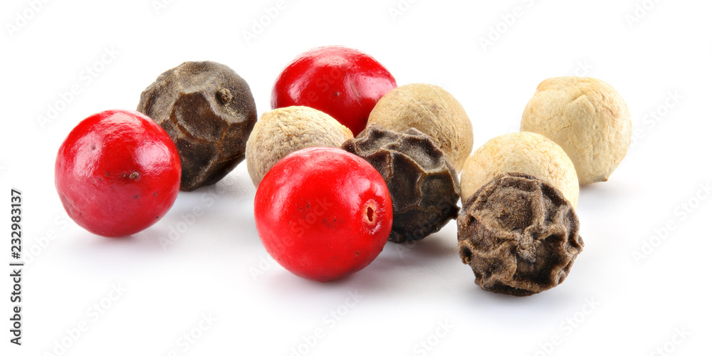 Mix of different peppers. Peppercorns isolated on white background. Macro. Full depth of field.