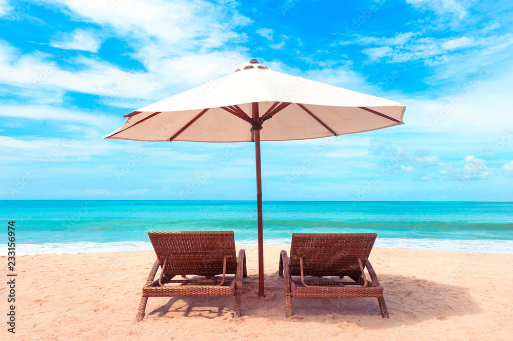 Beautiful beach. Chairs on the  sandy beach near the sea. Summer holiday and vacation concept.