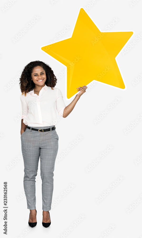 A cheerful woman holding a star