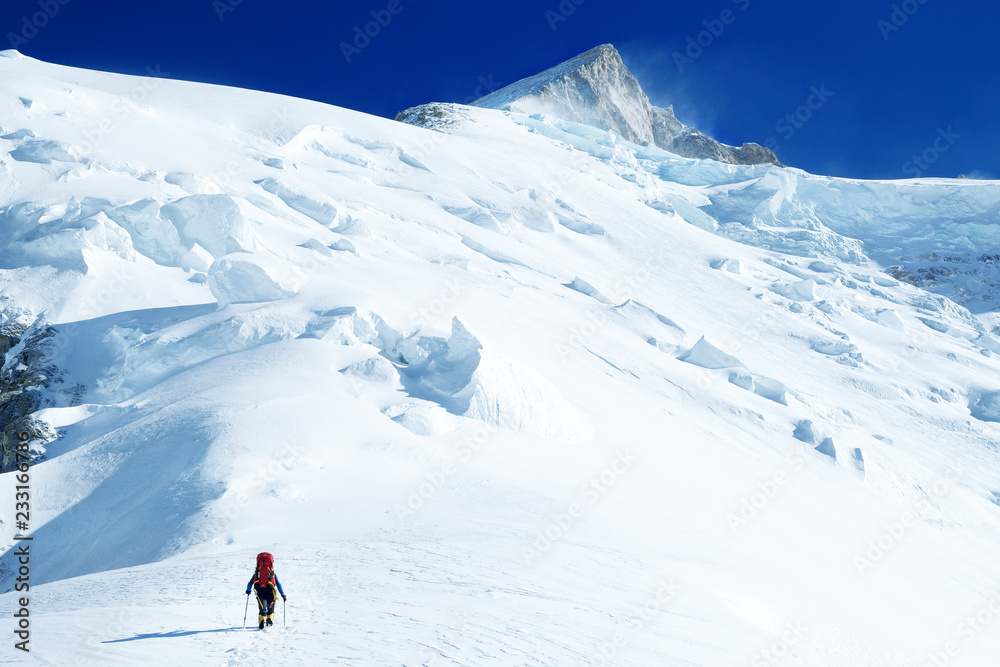 Mountaineer ascending summit 