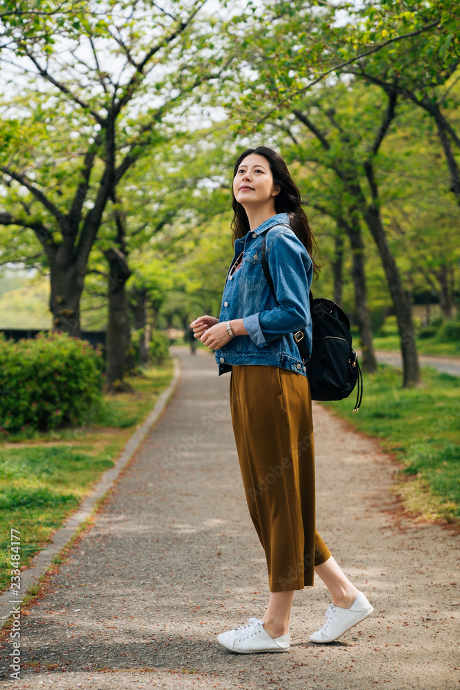 woman enjoy the beauty of the green park