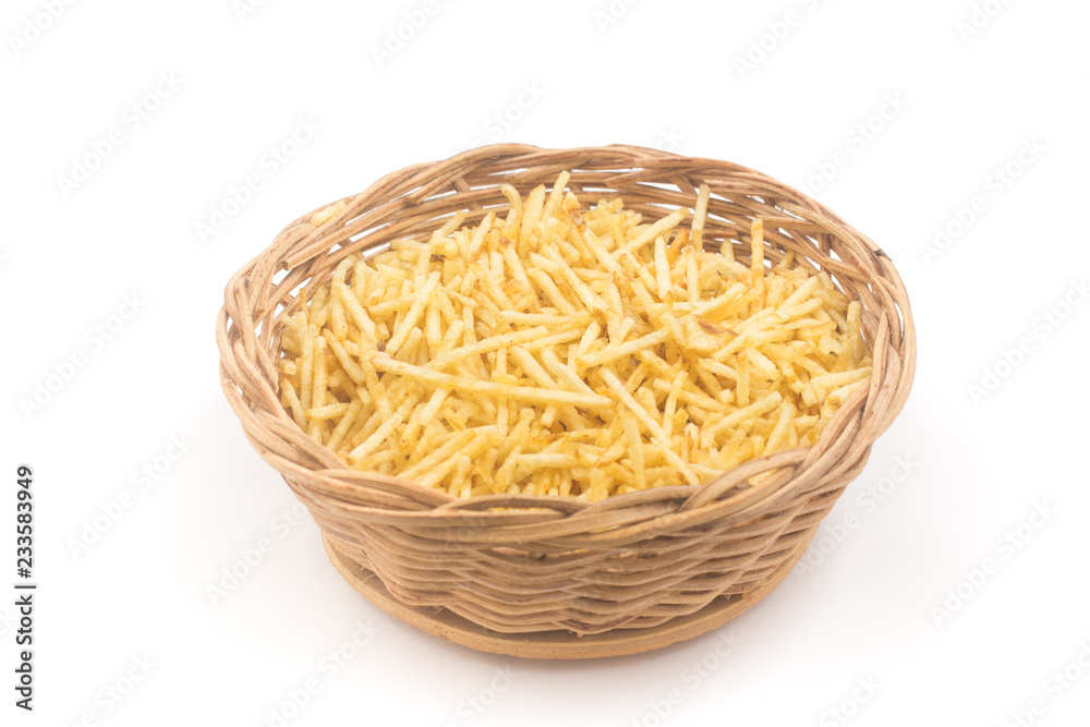 Potato Sticks in a basket bowl. Batata Palha