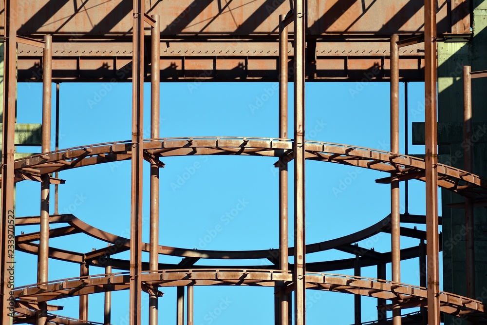 Fragment of a facade of a building with windows and balconies. Modern home with many flats.