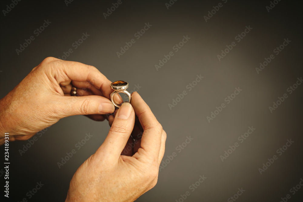 Goldsmith examining a ring