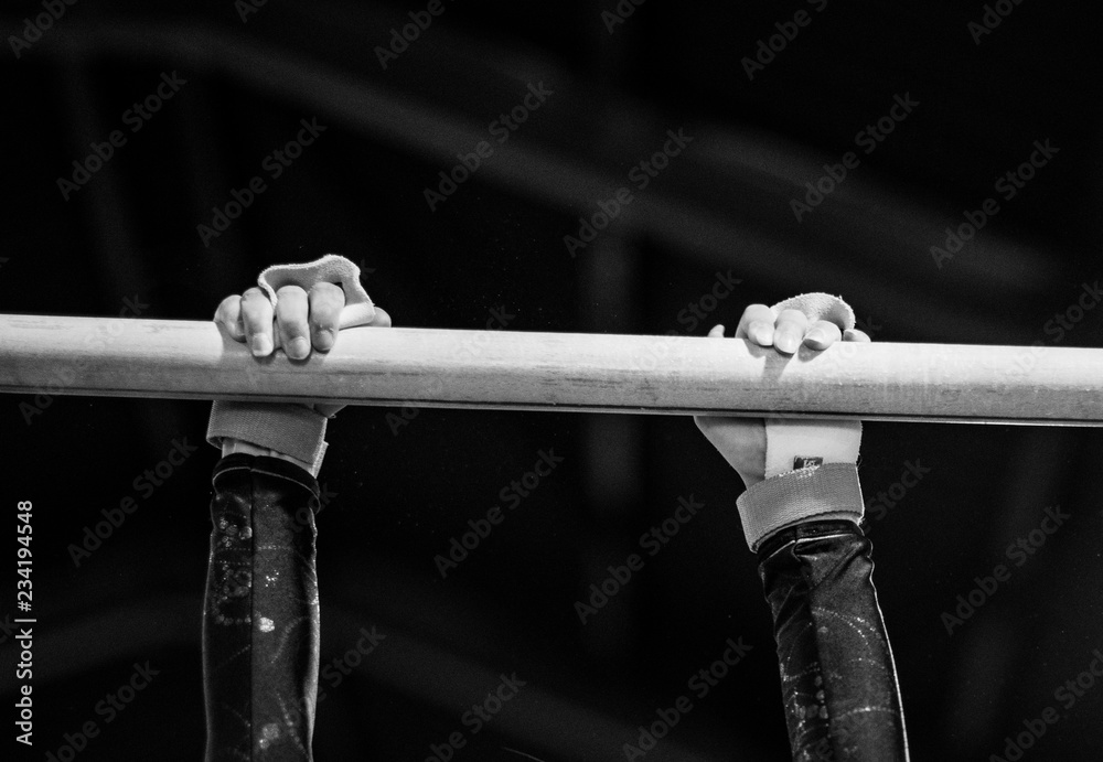 Young gymnast on a horizontal bar