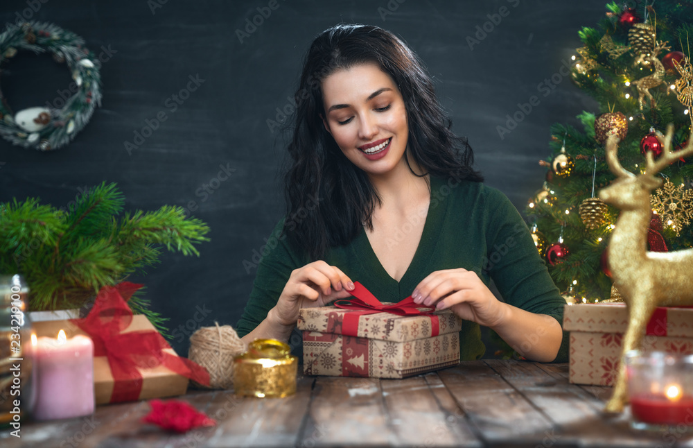 woman preparing a Christmas present