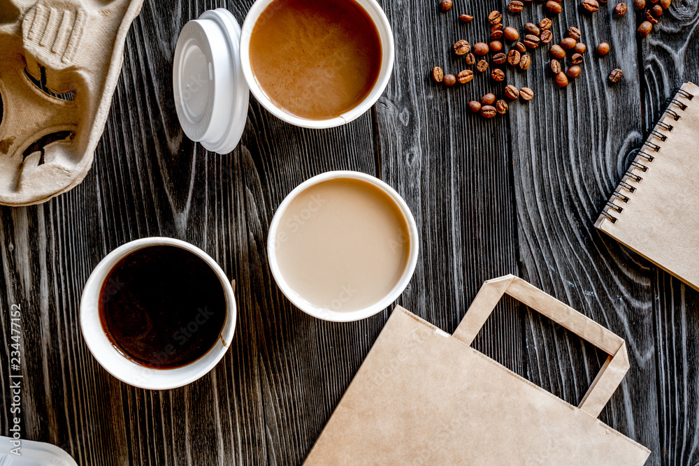 coffee cup take away at wooden background top view