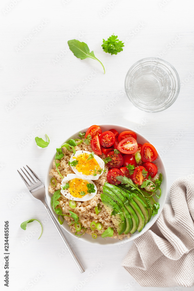 quinoa with boiled egg, avocado, tomato, arugula. healthy breakfast