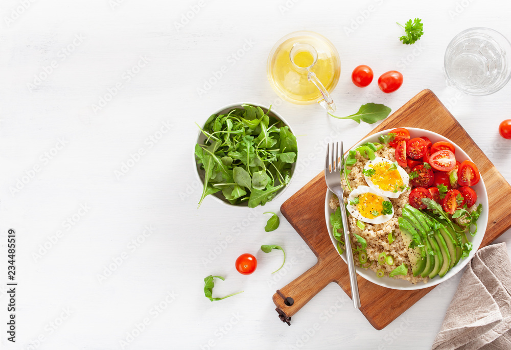 quinoa with boiled egg, avocado, tomato, arugula. healthy breakfast