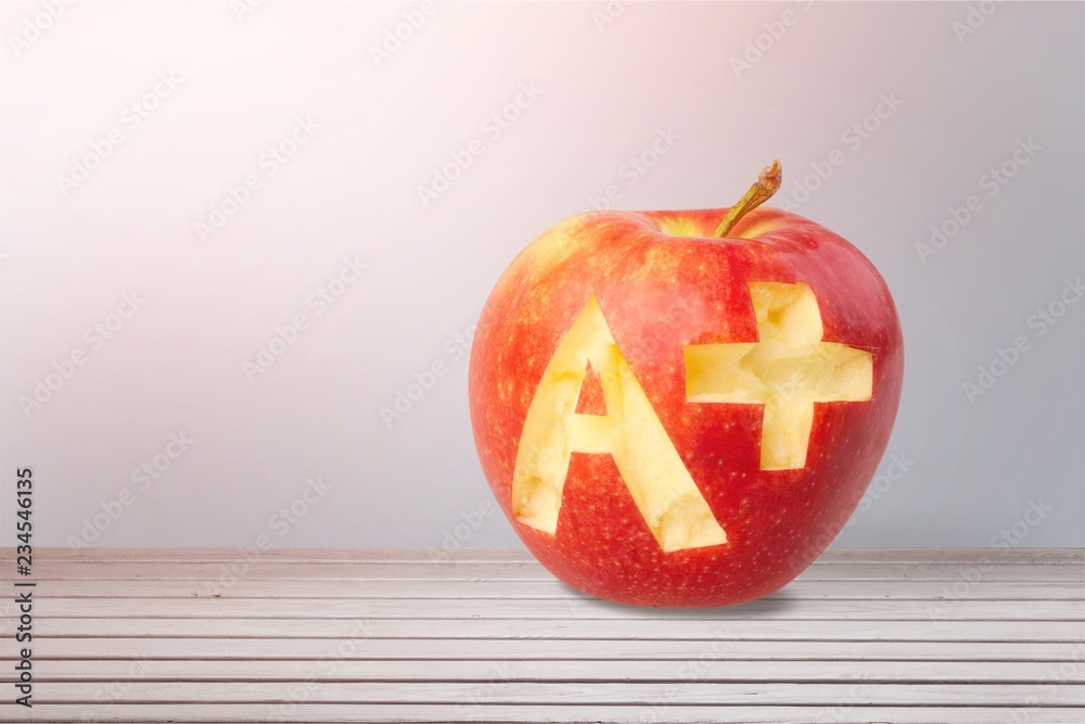 Fresh red apple  with a + isolated