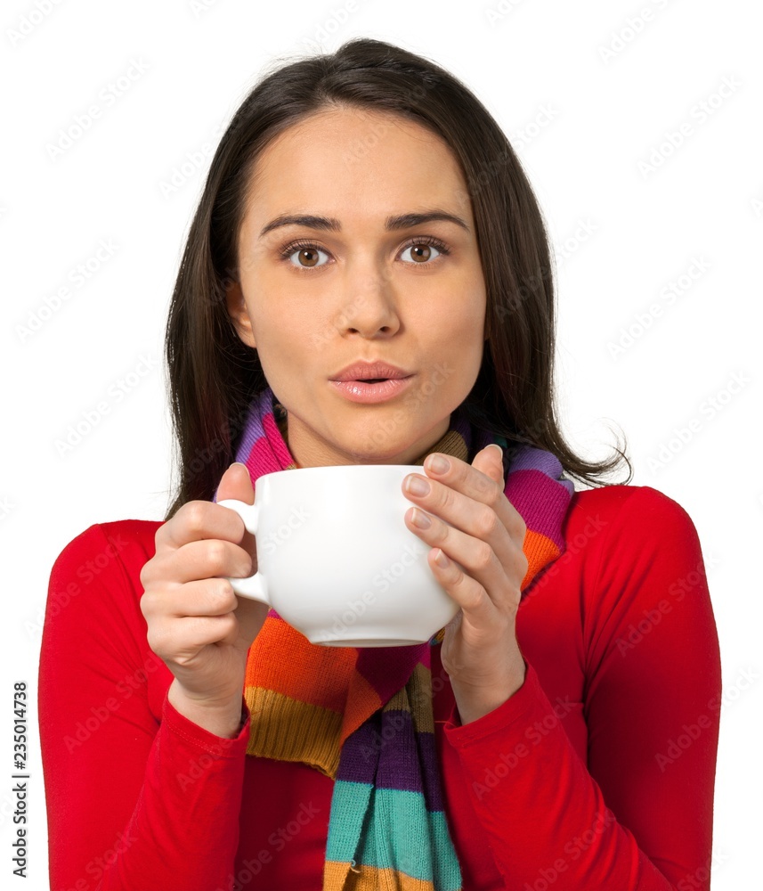 Young woman holding a large coffee mug