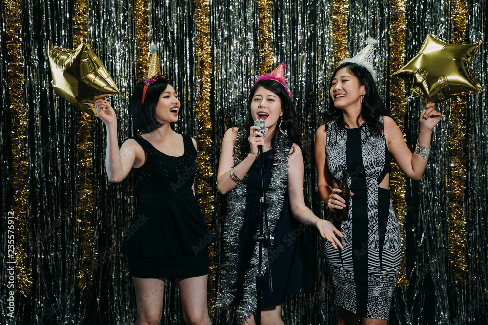 ladies enjoying music in karaoke party