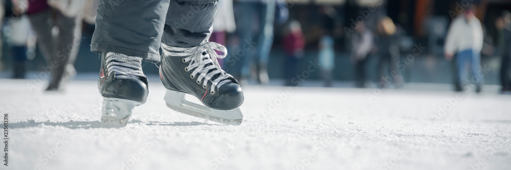 People ice skating on ice rink