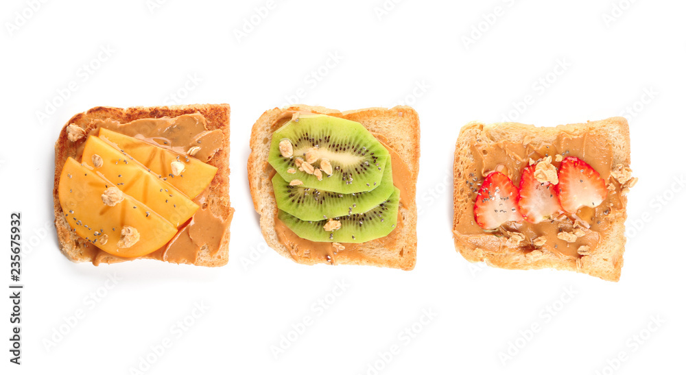 Different delicious toasts on white background