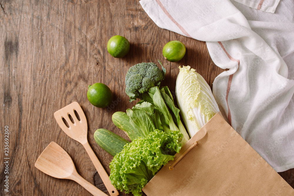 fresh vegetables in a brown paper bag