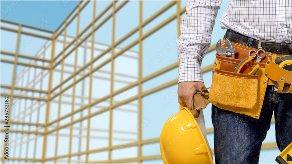 Worker with a tool belt. Isolated over  background.