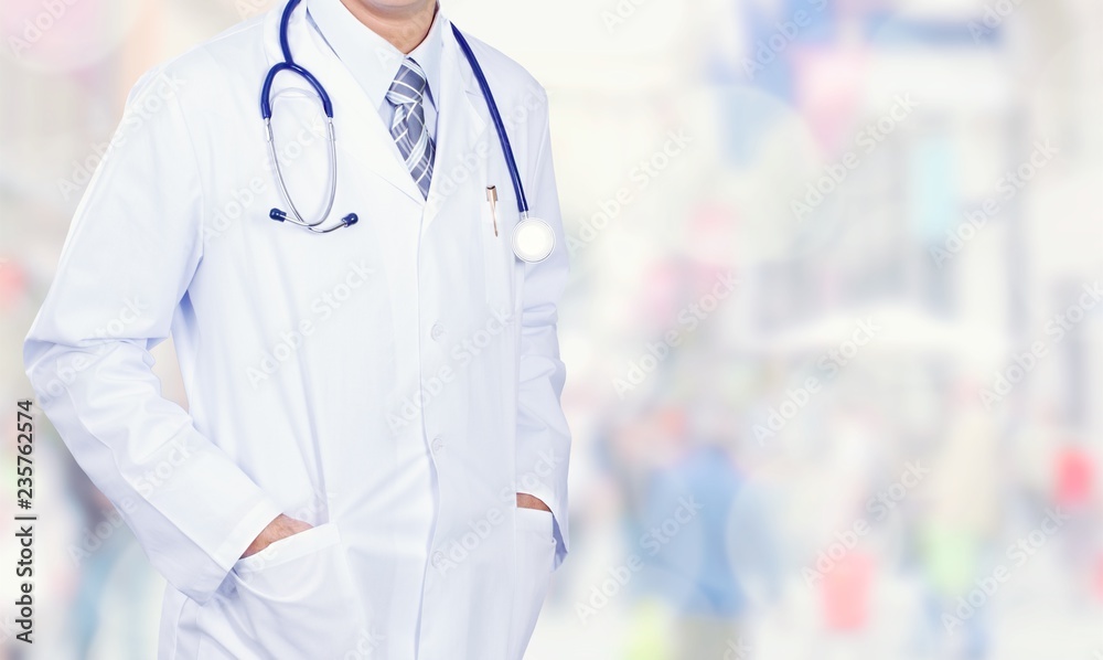 Doctor with stethoscope writing on background