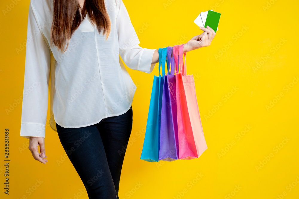 Shopping Woman concept, portrait or isolated an beautiful Asian woman holding shopping bags and cred