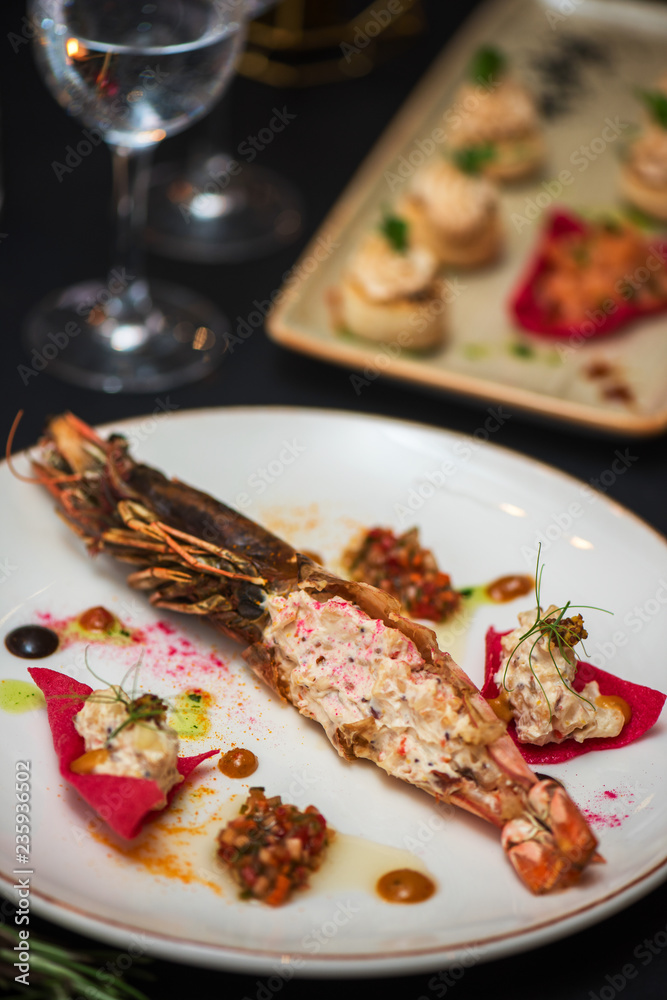 Cooked and stuffed crayfish on the table. Tasty restaurant dish