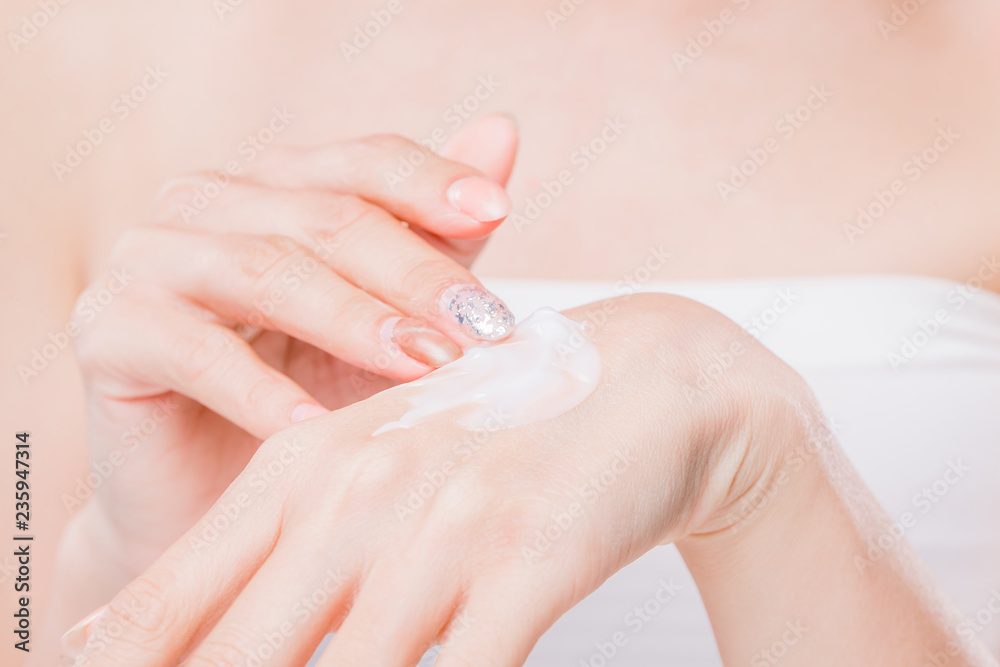 woman applying hand cream