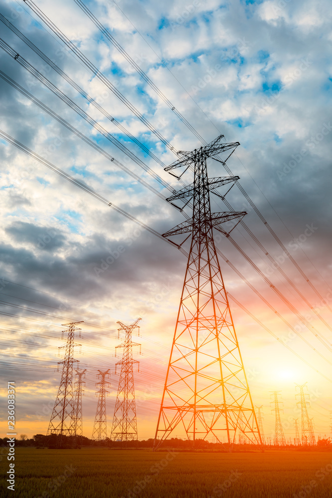 high-voltage power lines at sunset,high voltage electric transmission tower