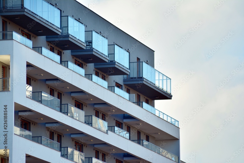 Modern apartment buildings on a sunny day with a blue sky. Facade of a modern apartment building