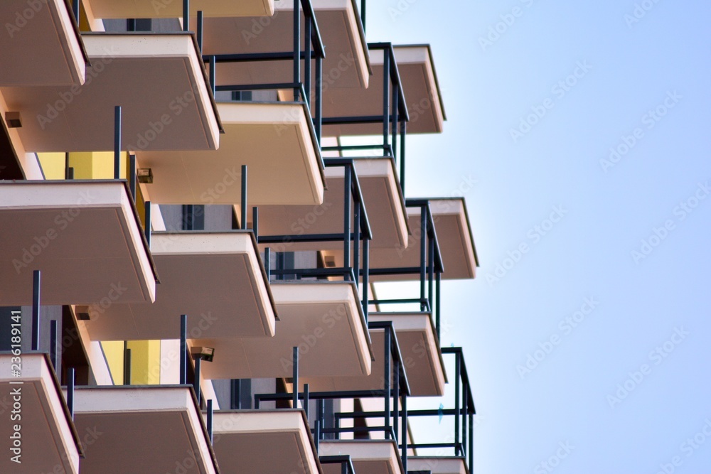 Modern apartment buildings on a sunny day with a blue sky. Facade of a modern apartment building