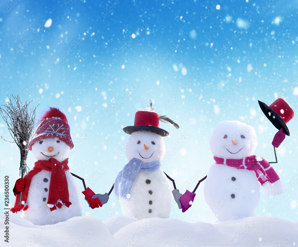 Merry Christmas and happy New Year greeting card with copy-space.Many snowmen standing in winter Chr