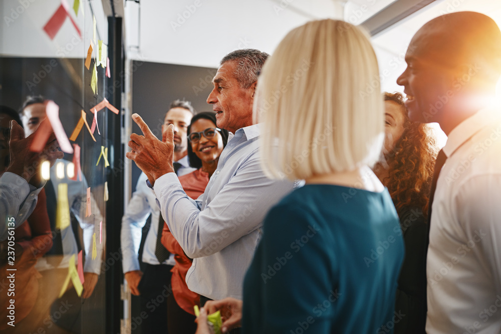 Diverse businesspeople brainstorming with their manager in an of