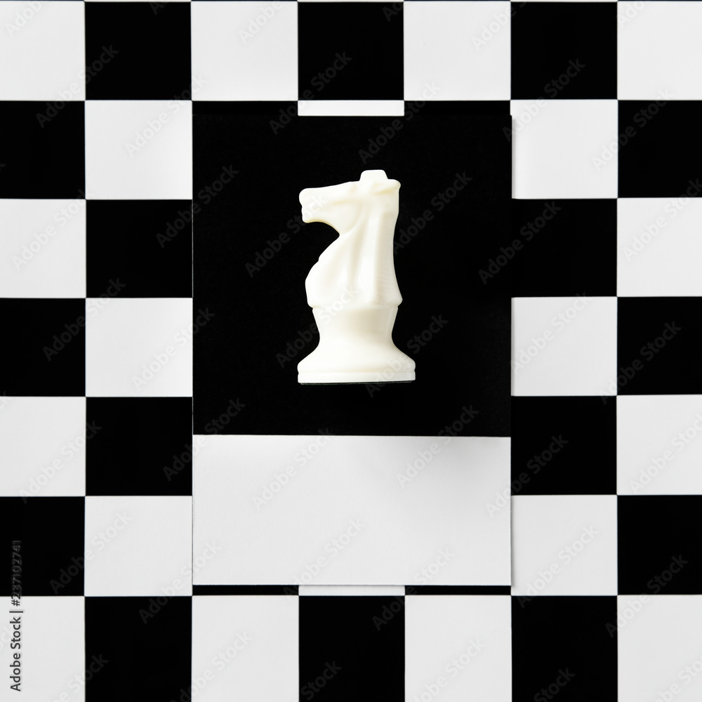 Knight chess piece on a pattern