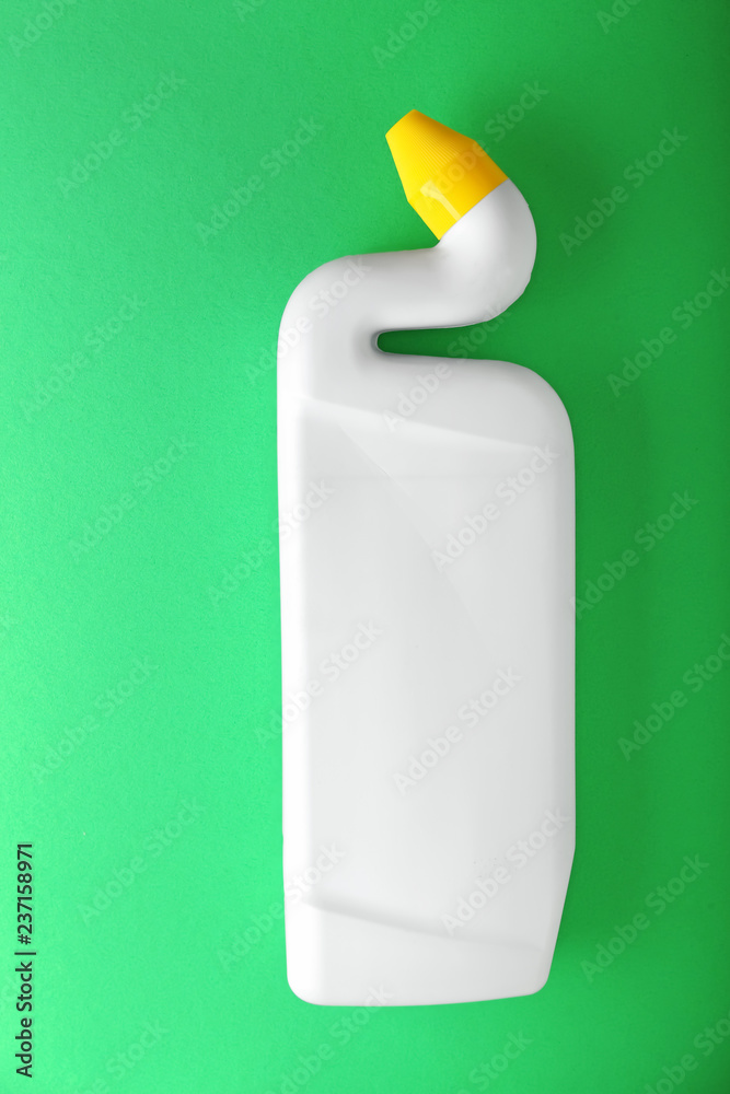 Bottle of detergent on color background