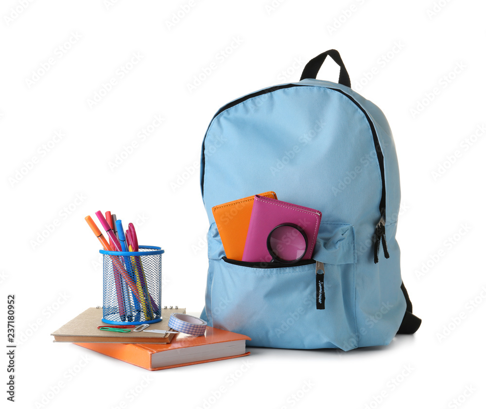 Backpack with school supplies on white background