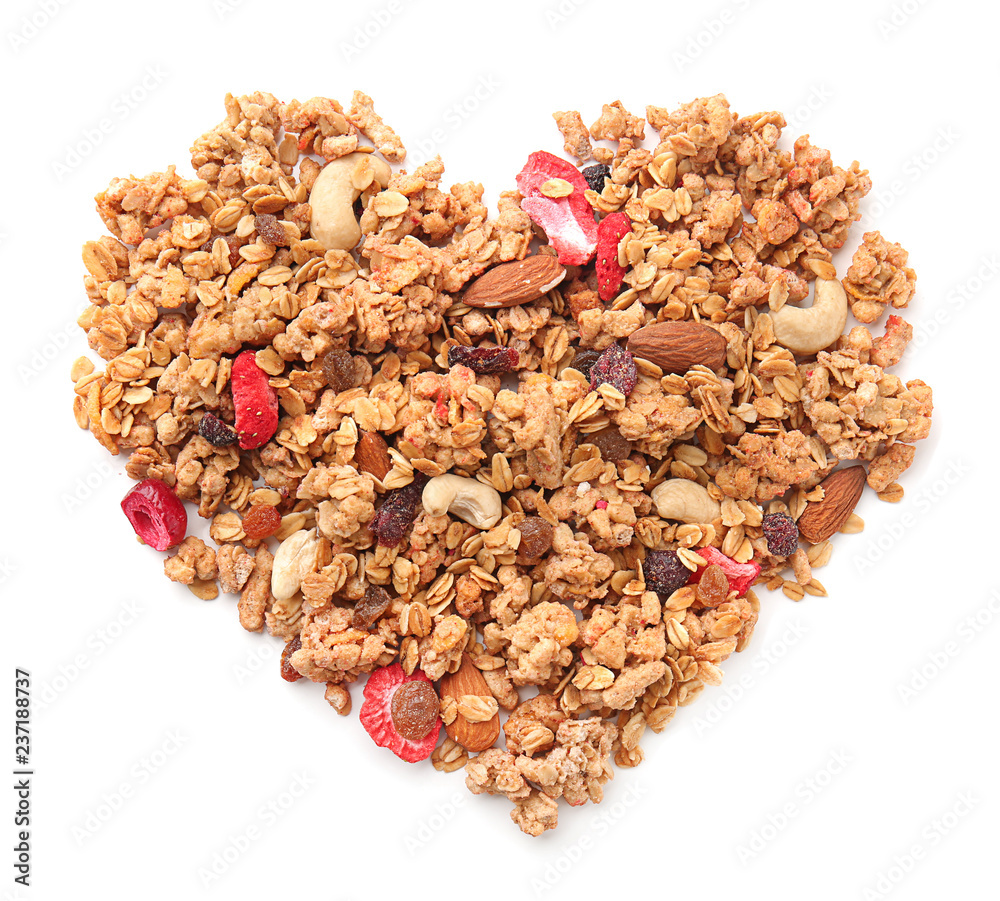 Heart made with granola on white background