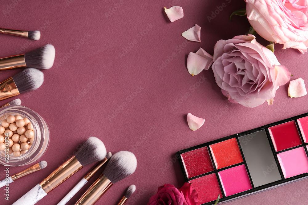 Composition with cosmetics and beautiful roses on color background