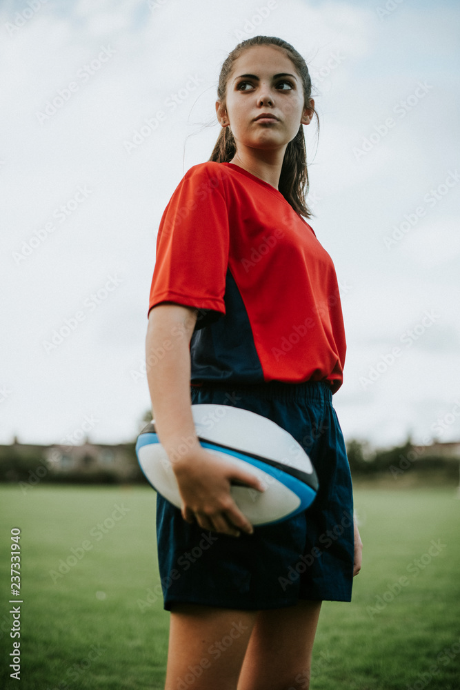 Confident female rugby player on the field