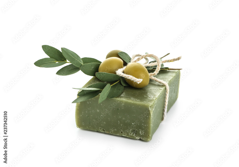 Soap bar with olives on white background