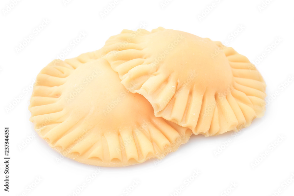 Raw ravioli on white background